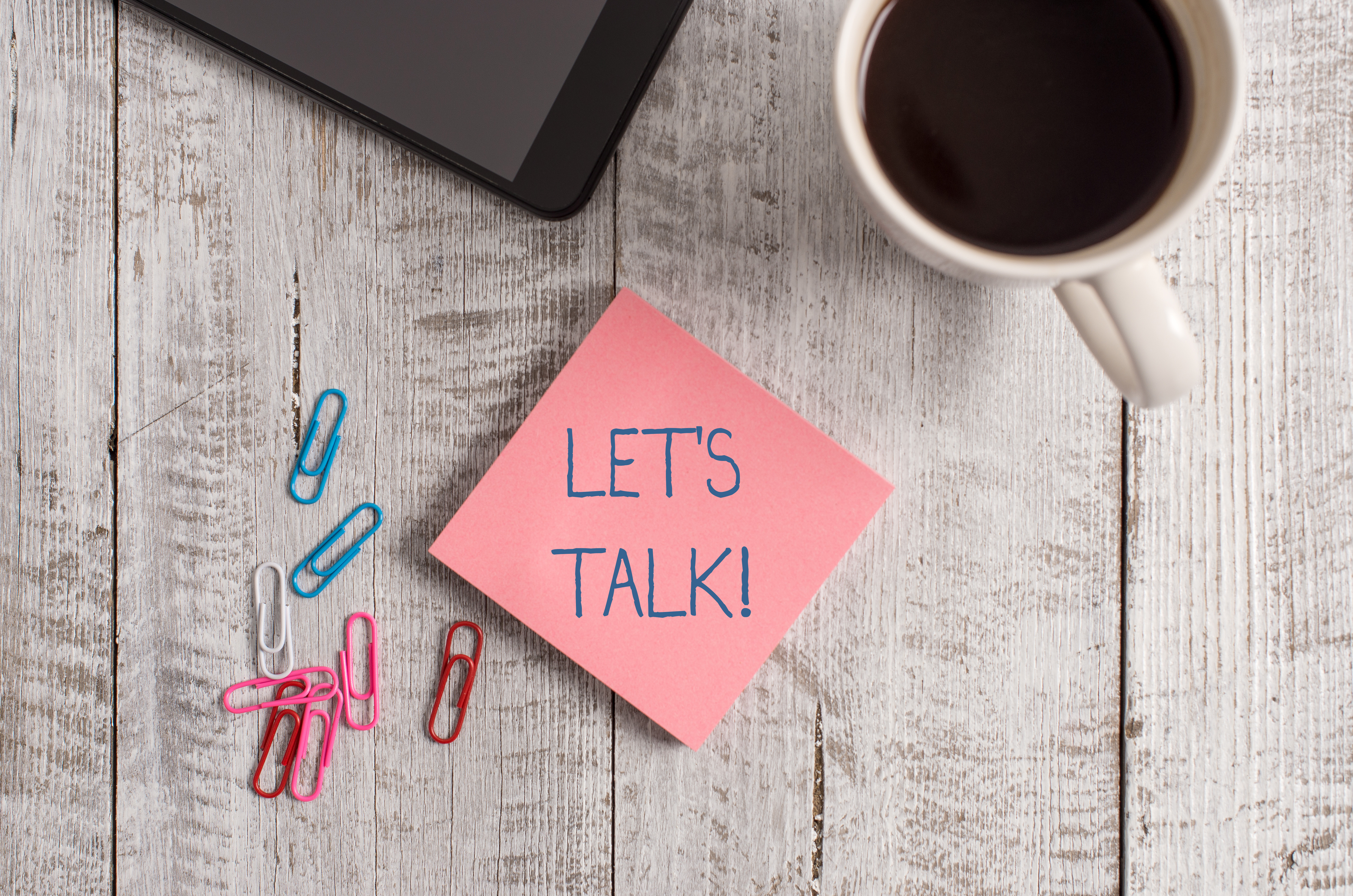 Sticky note that reads "Let's talk."